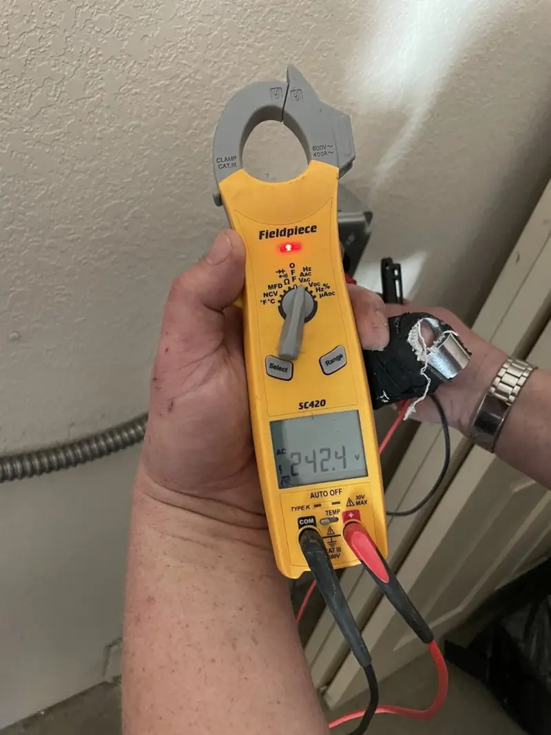 Voltage testing with clamp meter during Ceiling Fan Installation in Socastee